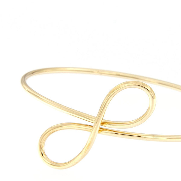 Bracciale flessibile in oro giallo con infinito