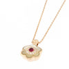 Collana in oro rosa con madreperla bianca rubini e diamanti